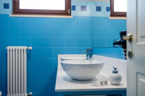 a bathroom with a bowl sink on a counter at Villa D'Aprile Exclusive Luxury Villa with pool, Jacuzzi, SPA in Castellana Grotte