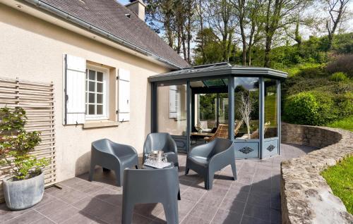 a patio with chairs and a gazebo at Pet Friendly Home In Omonville-La-Rogue in Omonville-la-Rogue
