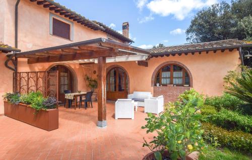 a patio of a home with a wooden pergola at Casa Calvana in Santa Maria a Monte