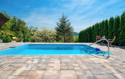 a swimming pool with a slide in a yard at Beautiful Home In Tuheljske Toplice in Tuheljske Toplice