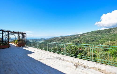 a balcony with a view of a mountain at Cozy Apartment In Perdifumo With Wifi in Perdifumo
