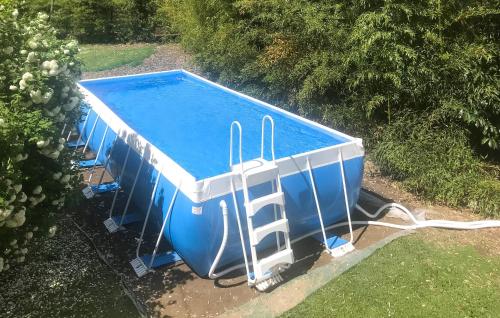 an overhead view of a swimming pool with a hose at Cozy Apartment In Molino Del Piano in Molino del Piano