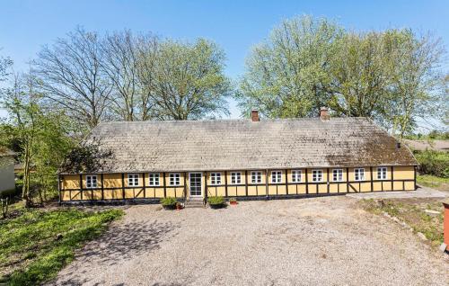 a large house with a thatched roof at 5 Bedroom Beautiful Home In Humble in Humble