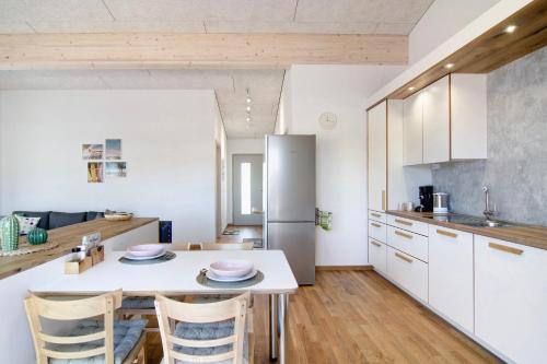a kitchen and dining room with a table and chairs at Ferienwohnungen Walz in Pfullendorf