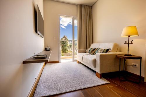 Cama ou camas em um quarto em Zur Suítes