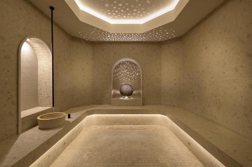 a bath tub in a room with a ceiling at Porto Angeli in Archangelos