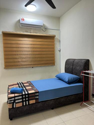 a hospital room with a bed with a ventilator on the wall at Ruzarani Home Meru Suria in Chemor