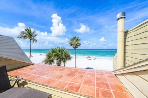 a view of the beach from the balcony of a house at Fanta-Sea 47 By Beachside Management in Siesta Key