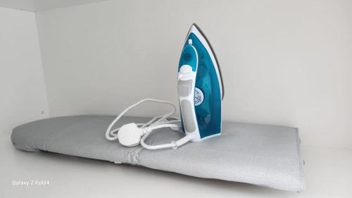 a surfboard is sitting on top of a bed at Penang Georgetown 3BRCPGF The Martian #TvBox in Jelutong