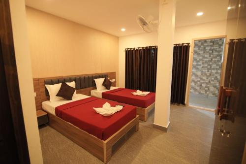 Una cama o camas en una habitación de Afa Residency