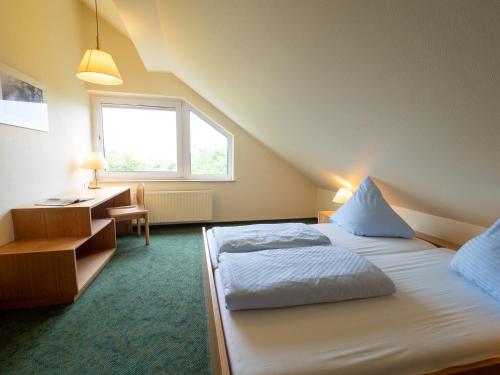 Postel nebo postele na pokoji v ubytování Appartementhaus Westerloog 21