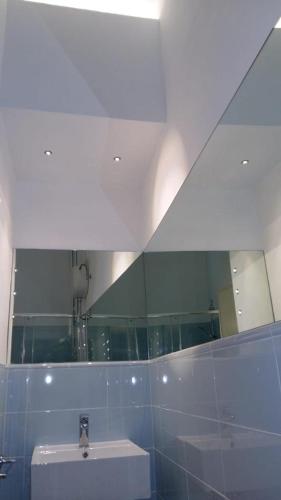 a bathroom with a sink and a mirror at Casa Per 2 in Porto Santo Stefano