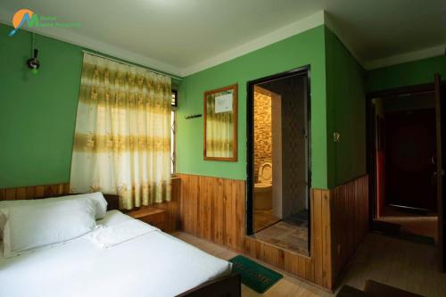 Postel nebo postele na pokoji v ubytování Hotel Mount Paradise