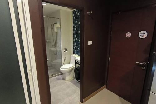 a bathroom with a toilet and a glass shower at Perfect Studio your holiday in Krabi Condo & Apartment in Ban Khlong Haeng