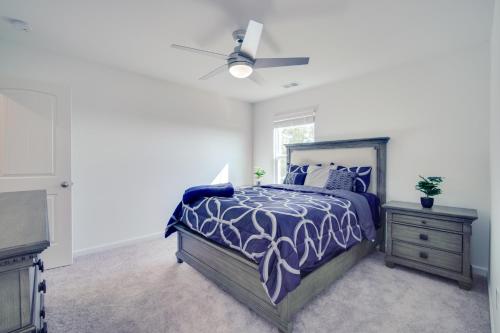 a bedroom with a bed and a ceiling fan at Modern Canton Home 10 Mi to Lake Allatoona! in Canton