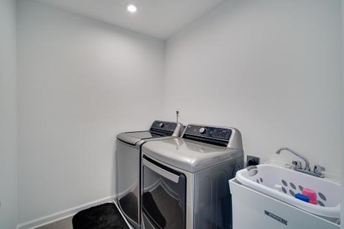 a white laundry room with a washer and dryer at Modern Canton Home 10 Mi to Lake Allatoona! in Canton