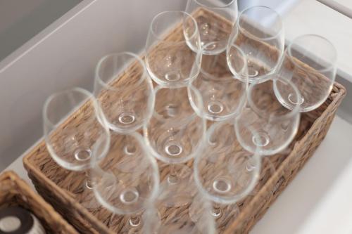 a bunch of wine glasses sitting in a basket at MT名嘉真 in Inbu