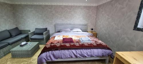 a bedroom with a bed and a couch at Studio Alex in Ghent