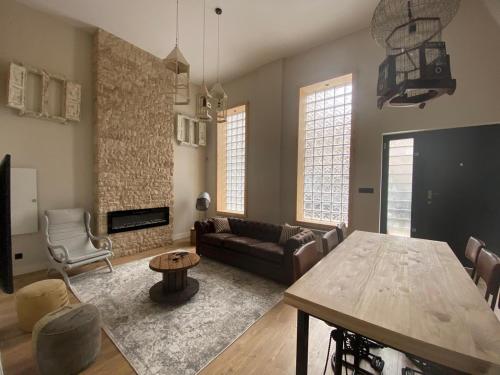 a living room with a table and a couch at Cornelia Suites 03 in Santander
