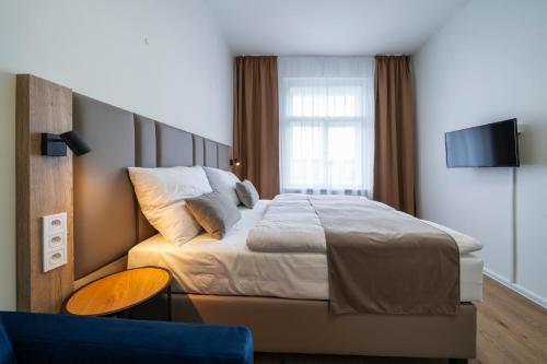Postel nebo postele na pokoji v ubytování Hotel LEON