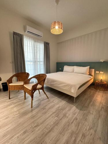 Postel nebo postele na pokoji v ubytování WinXin House