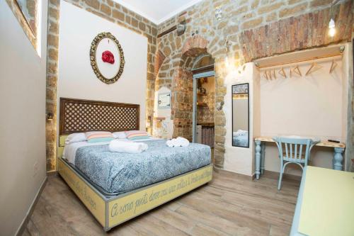 a bedroom with a bed and a table in a room at The Cave in Naples
