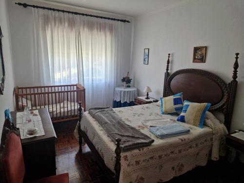 Кровать или кровати в номере Vivenda Atlantico