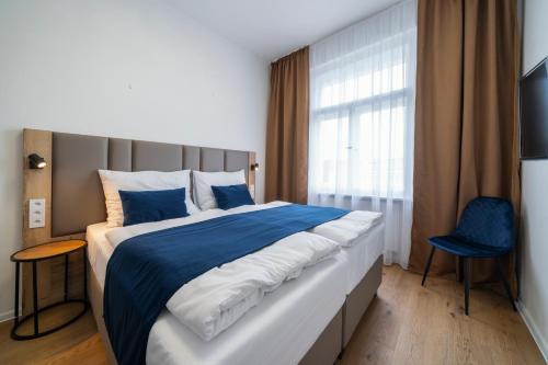 Postel nebo postele na pokoji v ubytování Hotel LEON