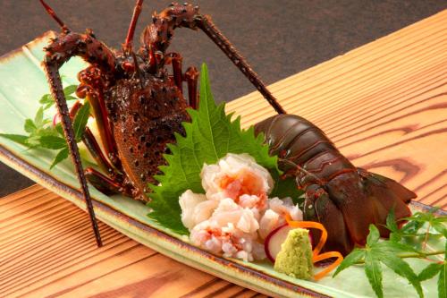 a plate of food with two insects on it at 伊豆高原の隠れ宿Syuhari守破離 in Ito
