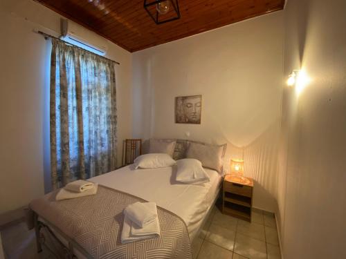 Кровать или кровати в номере Aphrodite Apartments