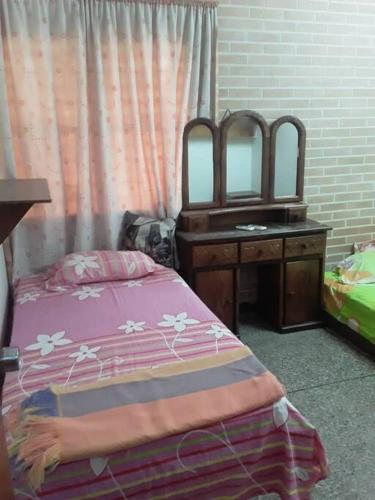 מיטה או מיטות בחדר ב-Casa-Quinta c-lindo Amb Familiar