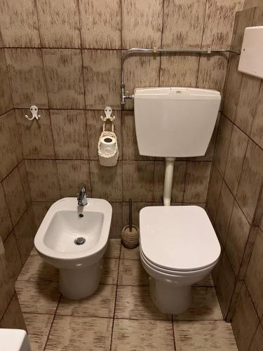 a bathroom with a toilet and a sink at SunFlower Apartment in Barcelona