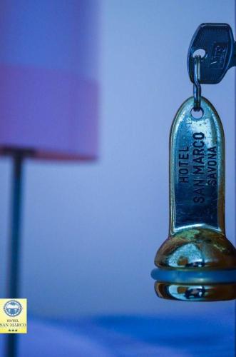 a close up of a key chain with a remote control at Hotel San Marco in Savona