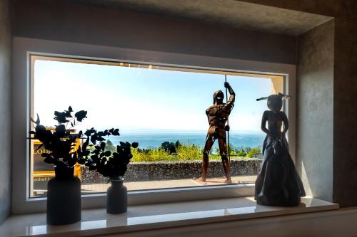 a statue of a woman looking out of a window at Bodensee-Hotel Sonnenhof in Kressbronn am Bodensee