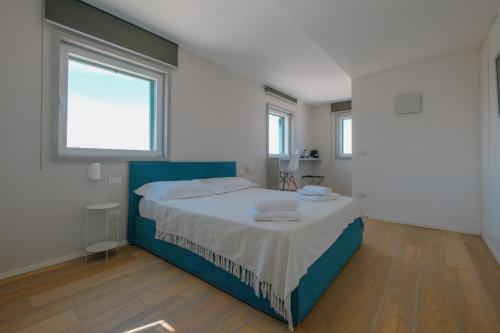 a bedroom with a bed with two towels on it at La Finestrella in Bari