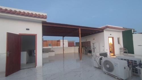 a large white house with a large patio at Laguna house in Dahab