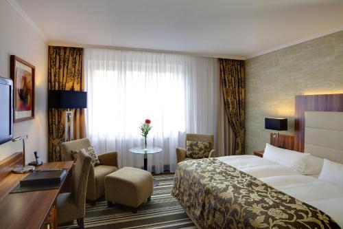 Ένα ή περισσότερα κρεβάτια σε δωμάτιο στο Best Western Plus Hotel Böttcherhof