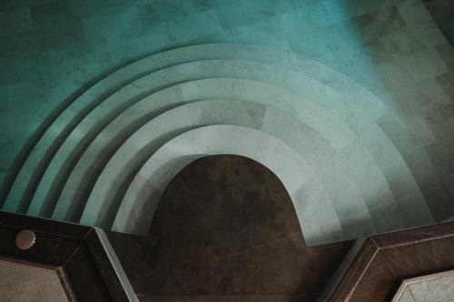 a spiral staircase in a building at Residence Hotel Alpinum in Campo Tures