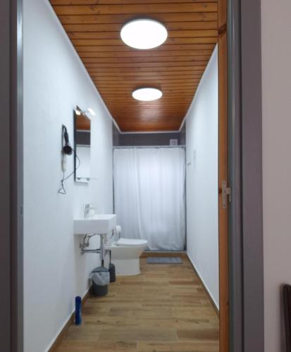 a bathroom with a sink and a toilet at Adamas Bed & Breakfast in Ponta Delgada