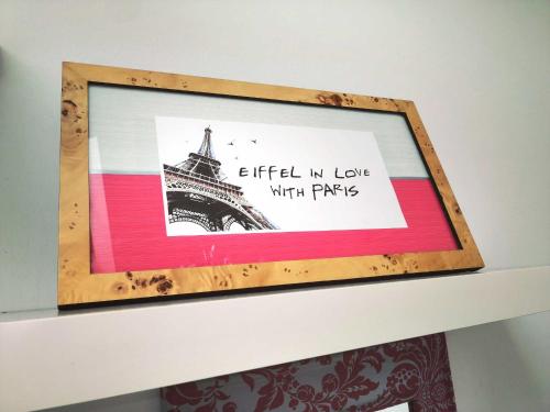 a picture of the eiffel tower on a shelf at The Small Arms Factory in Enfield Lock