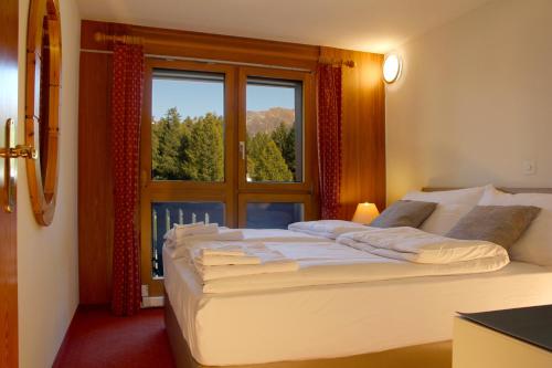 Posteľ alebo postele v izbe v ubytovaní Aparthotel Ambassador