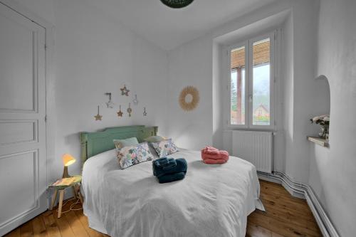Ένα ή περισσότερα κρεβάτια σε δωμάτιο στο Appartement à Luchon