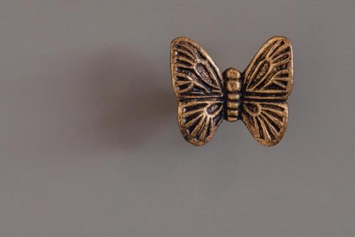 a bronze butterfly is sitting on a table at Luxury Recently Renovated 3 Bedroom home in Sandwich Kent in Sandwich
