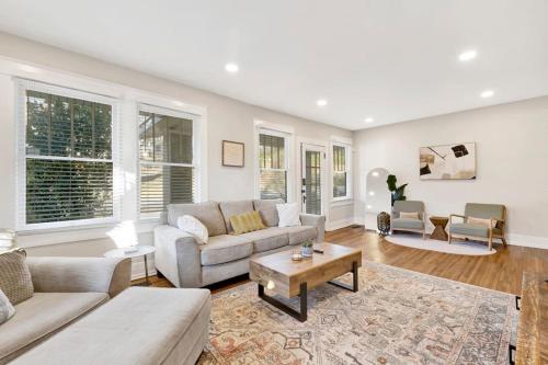 a living room with a couch and a table at Historic family getaway mins from downtown in Birmingham