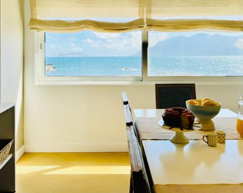 a dining room with a view of the ocean at Canaryislandshost I Marino in Famara