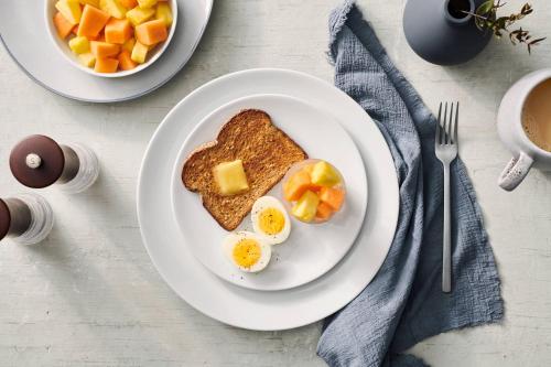 a plate of eggs and toast on a table at TownePlace Suites Gaithersburg in Gaithersburg