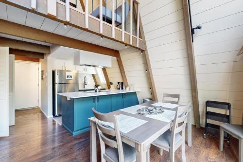 a kitchen and dining room with a table and chairs at Sunshine in Sunriver in Sunriver