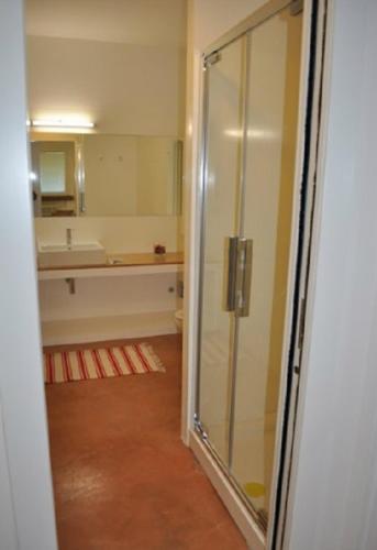 a bathroom with a glass shower and a sink at Agriturismo Cà Mignone in Urbino
