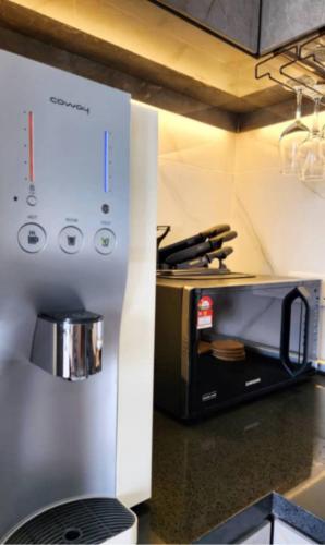 a kitchen with a toaster oven on a counter at Penang Georgetown 3BRCPGF The Martian #TvBox in Jelutong