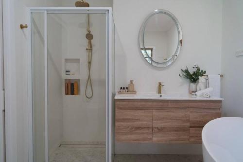 a bathroom with a shower and a mirror at Yasar farm stay Marshall view 